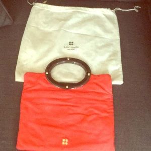 KATE SPADE SATIN CORAL W/ TORTOISE SHELL HANDLE.